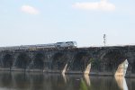 AMTK 121 with the westbound Pennsylvanian on Rockville bridge